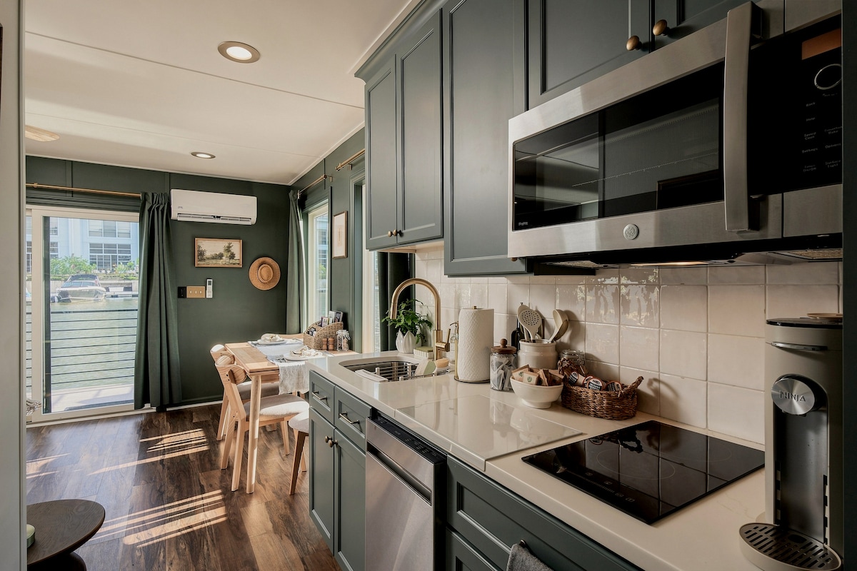 Kitchen with cooktop and microwave