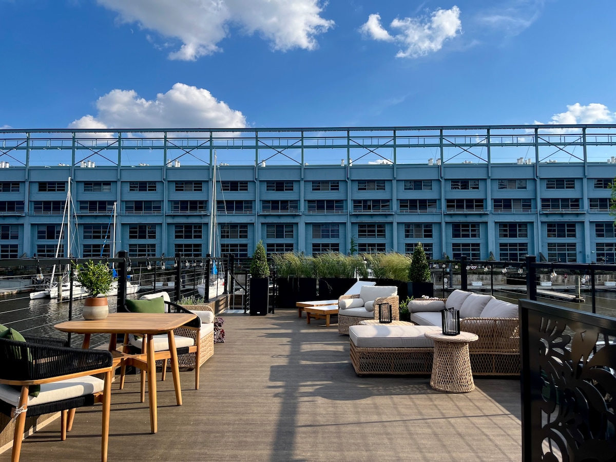 Rooftop deck lounge and dining above the marina