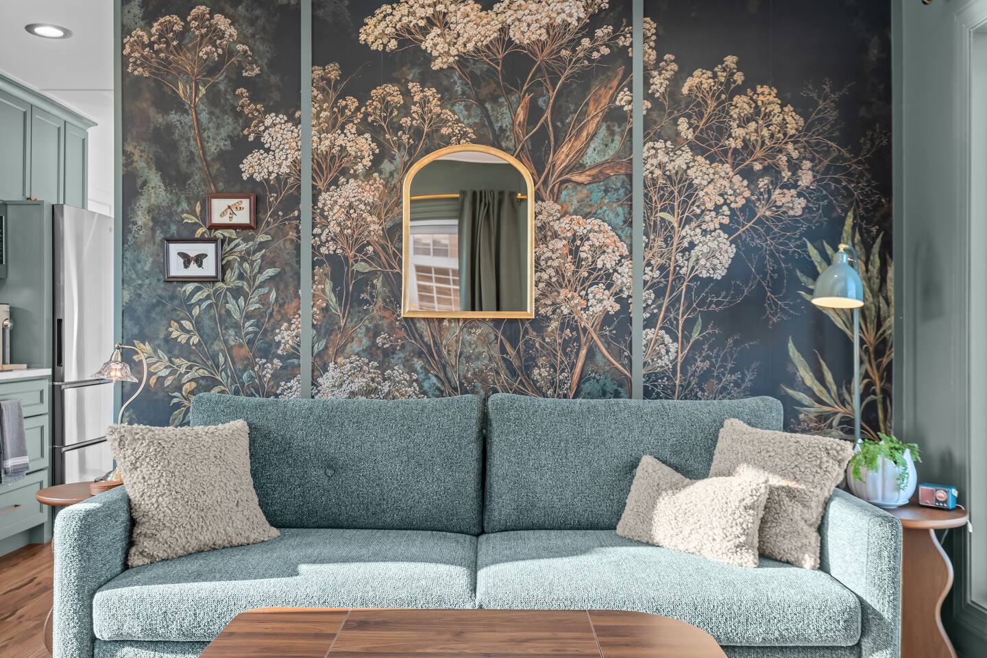Sofa beneath the botanical mural